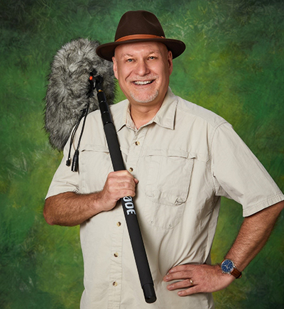 Dr. Bryan Pijanowski poses with a field microphone