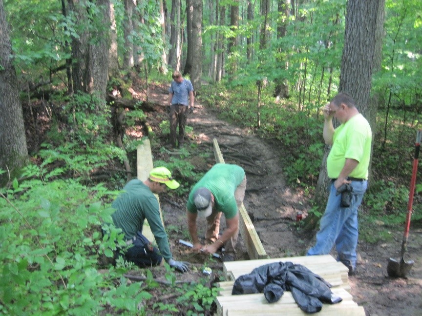 Workers clearing and working on trails, Stewart Woods.