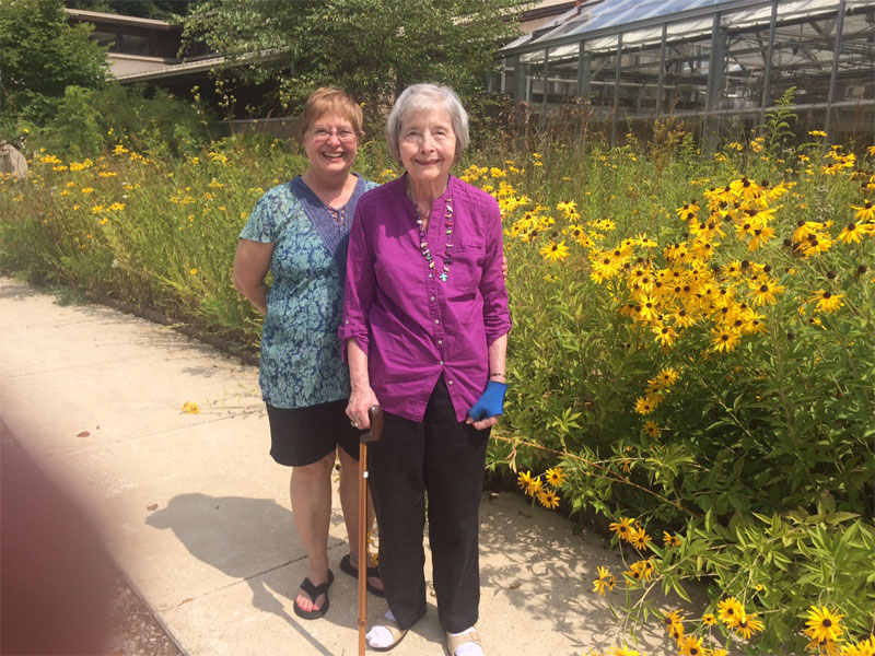 J.L. Van Camp's daughter and granddaughter, Boo and Pam, came to visit Arboretum and took photo in front of the Wright Center in 2014.