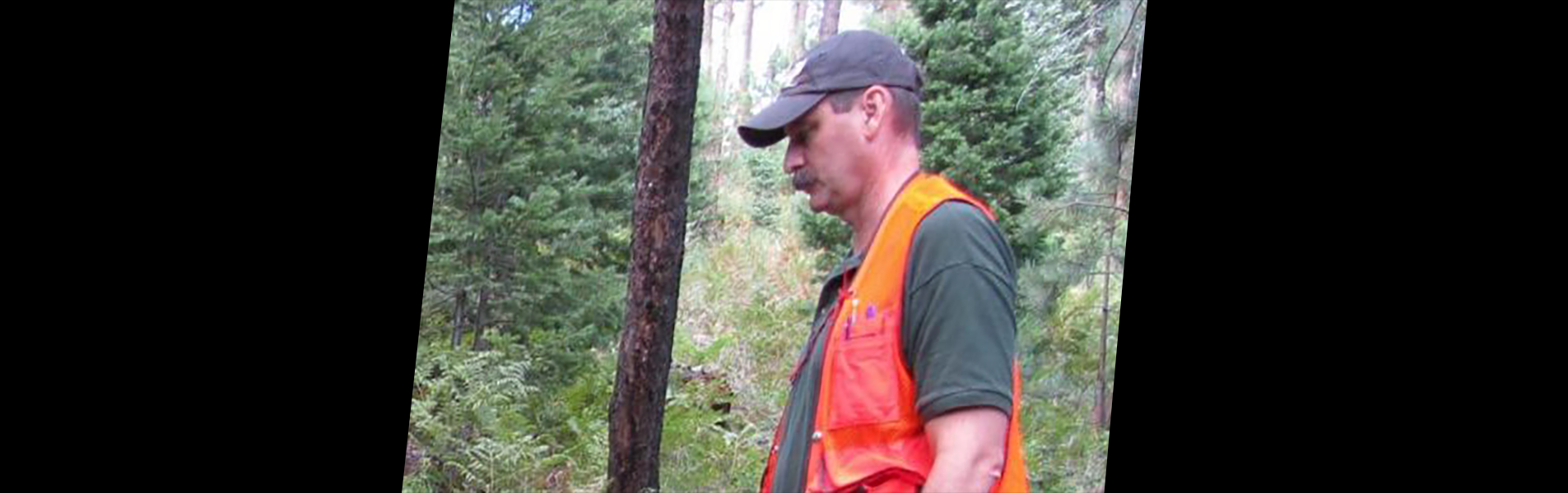 Tim Robards, President of TYLD Corp, walking in the forest.