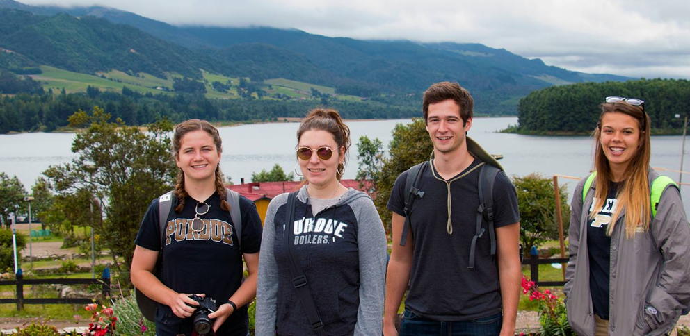 Four Purdue students with mountains in background while in Columbia, Study Abroad program.