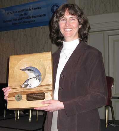 Petra Bohall Wood holds her atrners in Flight Research Award in 2008