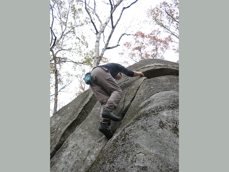Dr. Doug Jacobs rock climbing.