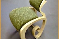 Green chair with curved legs.