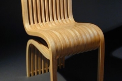 Wooden chair with multi-row back legs.