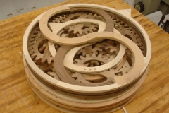 Wooden gears in round display.