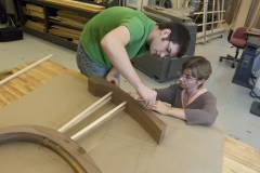 Student and instructor work on furniture project.
