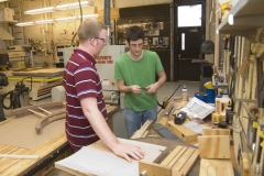 Students work on wood project.
