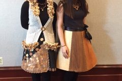 Two model wooden made dresses.