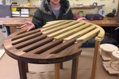 Student shows expandable wooden table.