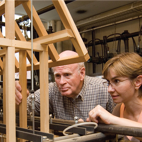 Dr. Carl Eckelman and Eva Haviarova conducting research on wood frame in lab.