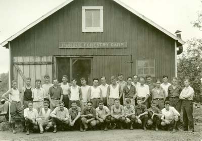 Students of first forestry camp in front of the old red barn, June 1929. Click on photo to view names. (Accession No. FNR.1929.PRI.010)