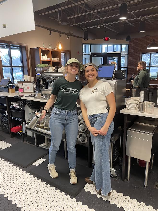 Leah working at Greyhouse Coffee Shop with a coworker