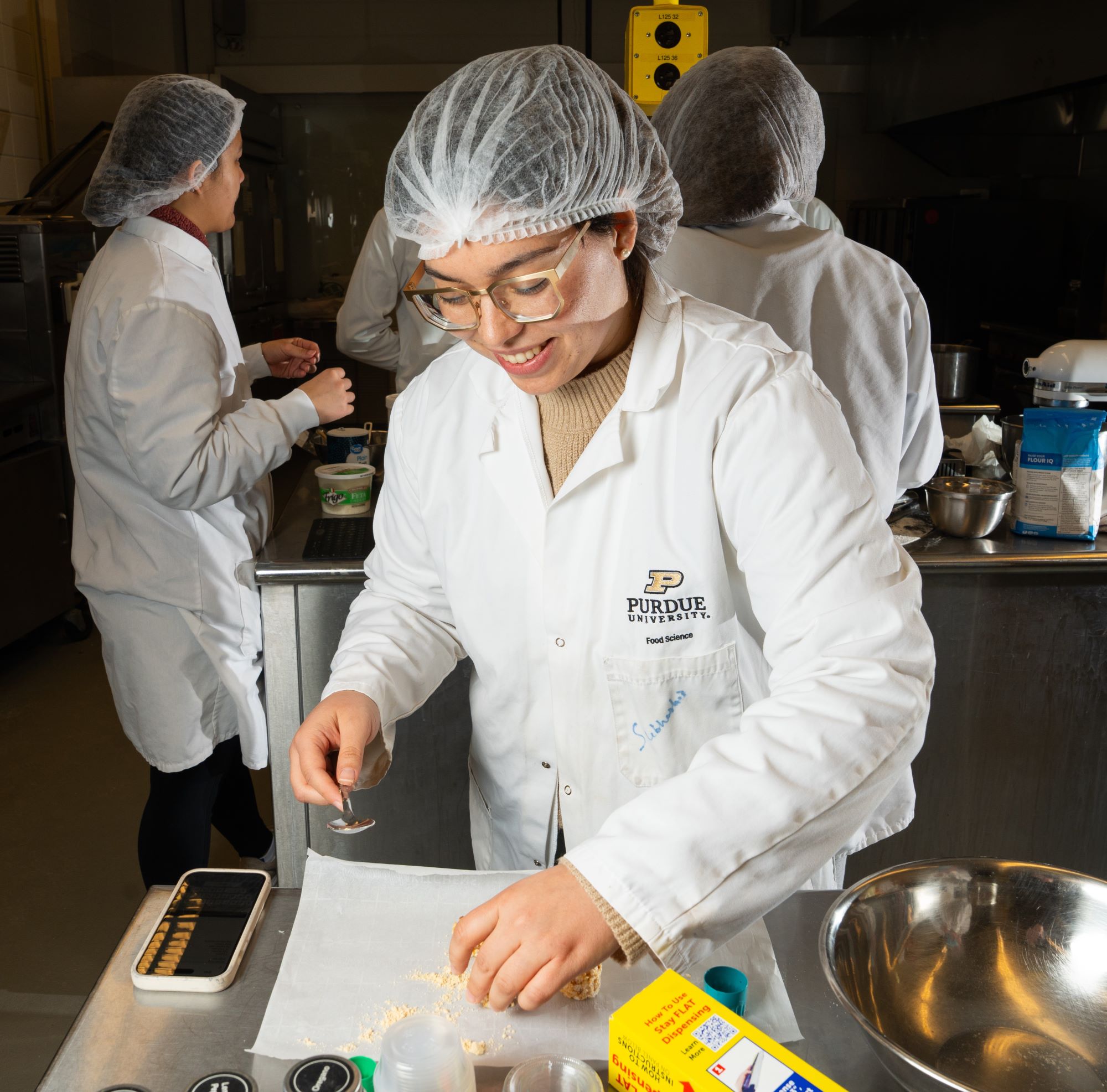 Student preparing soy-based food product