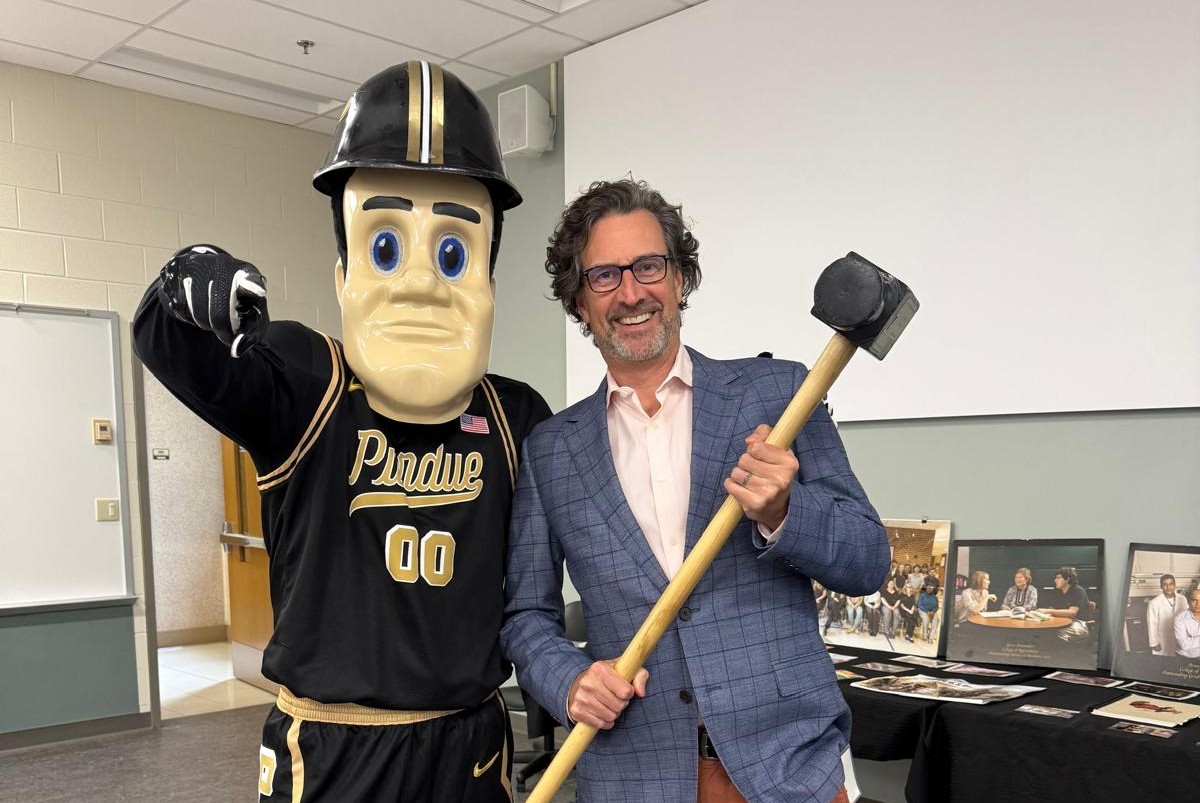 Man posing with Purdue Pete