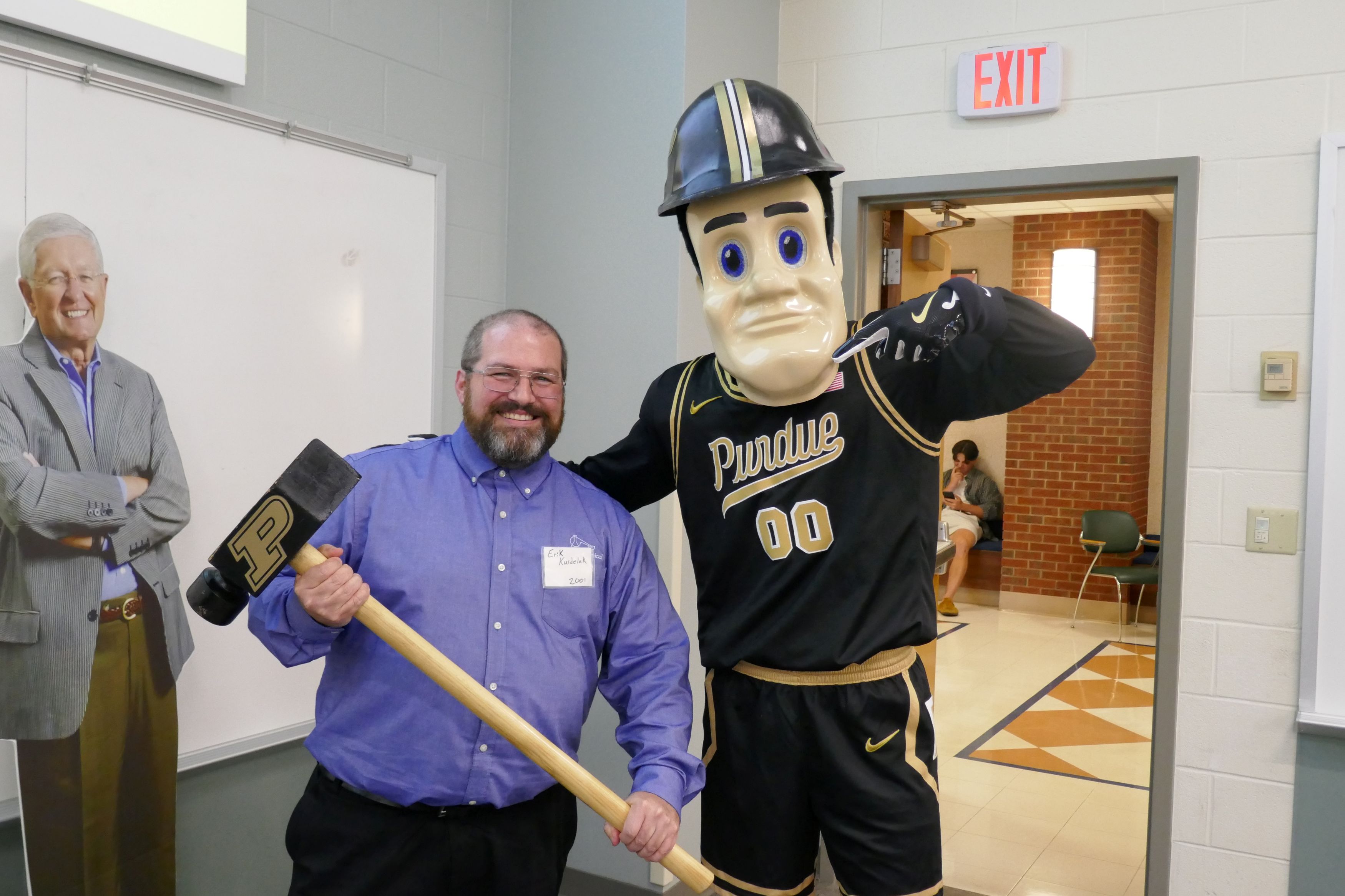 Man poses with Purdue Pete