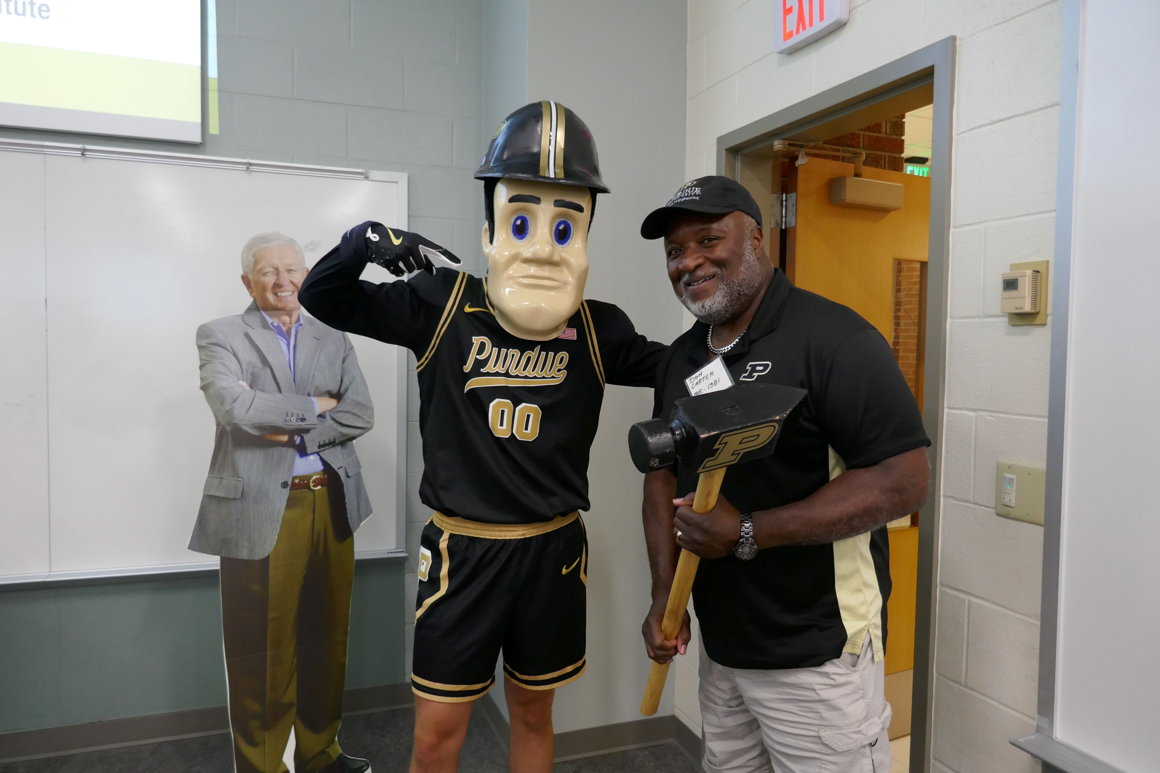 Man poses with Purdue Pete
