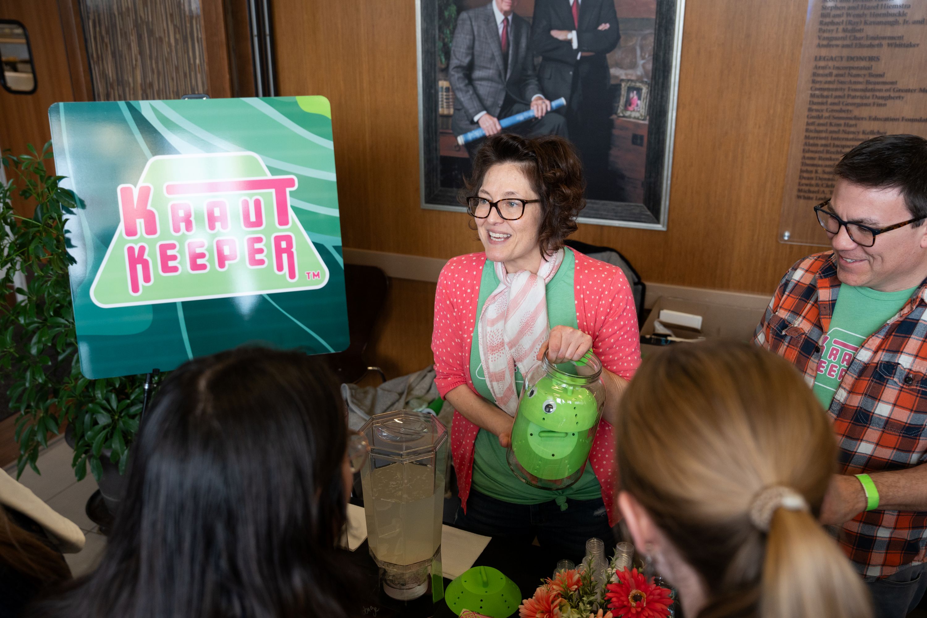 Woman holding a green jar