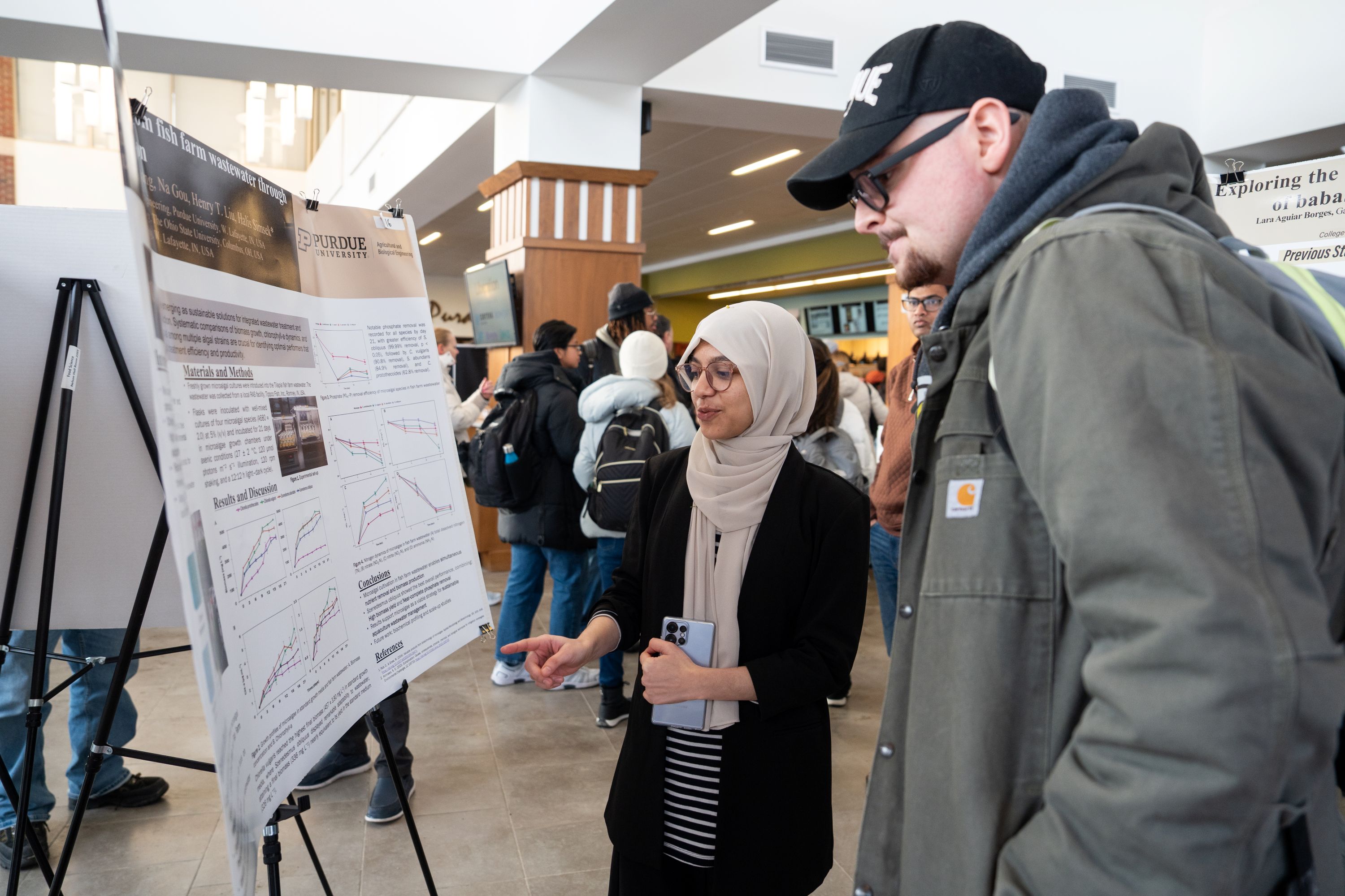 Woman presenting research poster