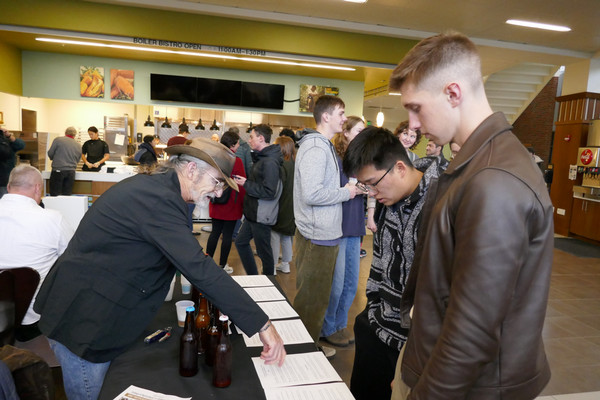 Students talk to a vendor at Fermentation Frenzy