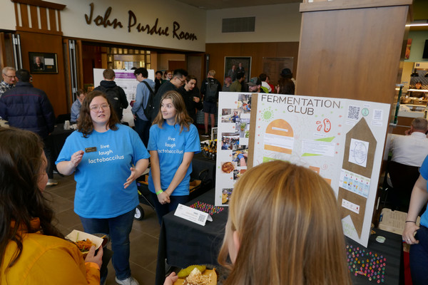 Students from Fermentation Club talk to attendees