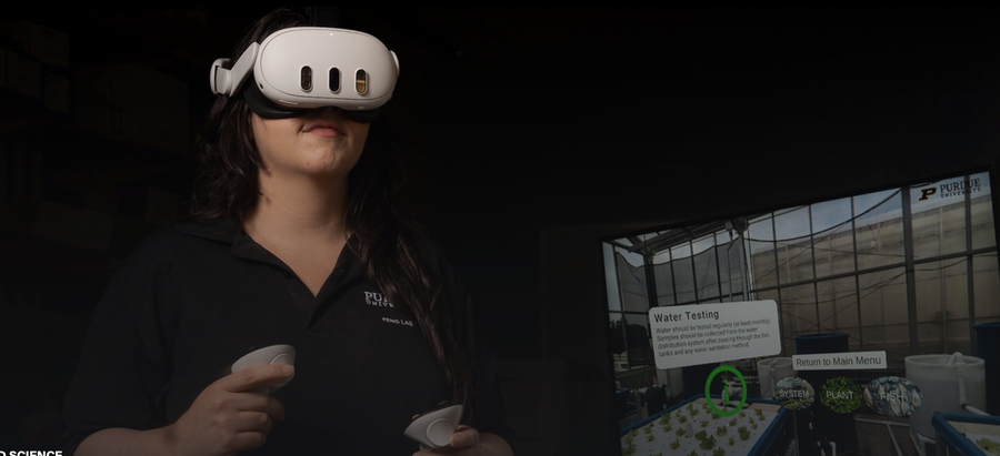 student using virtual reality headset to view virtual aquaponics greenhouse