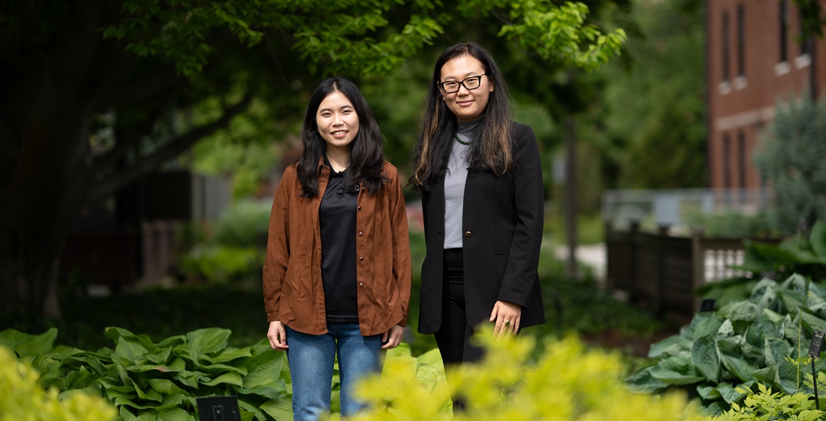 Han Chen (left) and Dr. Betty Feng (right) standing outdoor