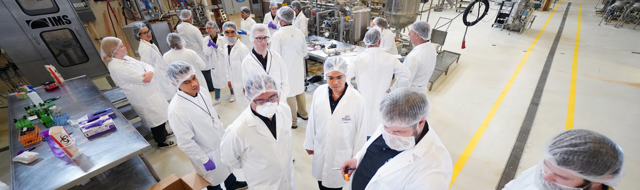 group of people in lab coats in lab