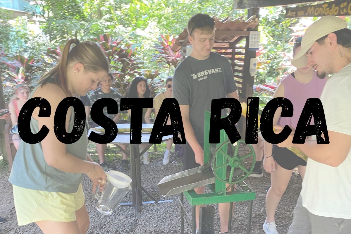 Students squeezing juice in Costa Rica