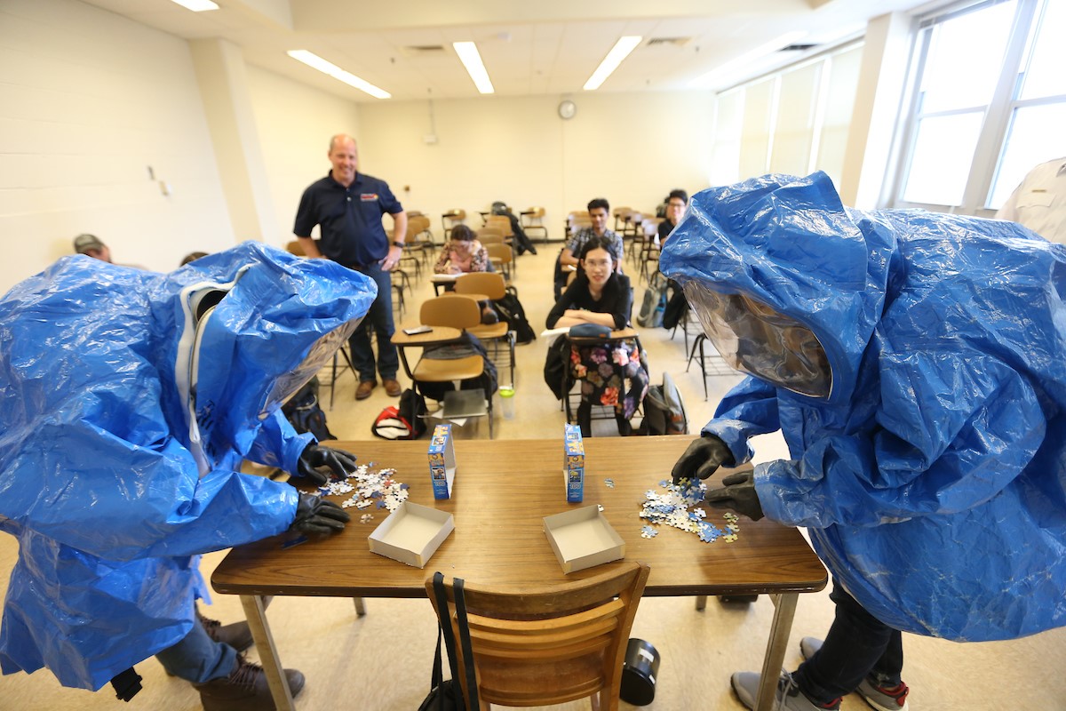 hazwoper students in hazmat suits motor skill test