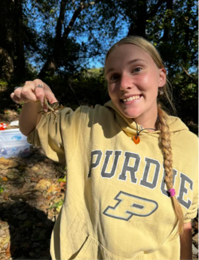 Person holding a crawdad.
