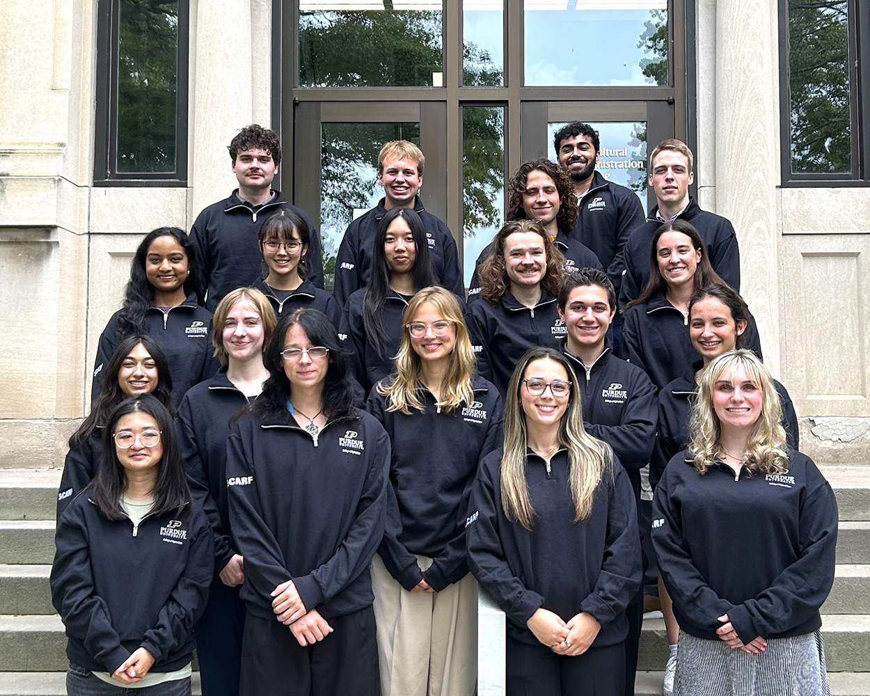 Group of SCARF students pose in front of Ag building