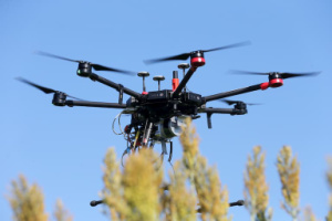 uav in air over sorghum