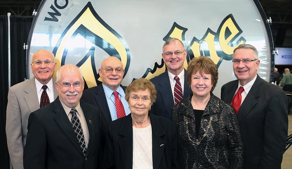 The Certificate of Distinction Award Recipients stand in front of the The Purdue Big Bass Drum