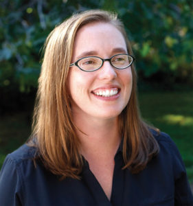 Sarah Williams smiles in an outdoor photograph