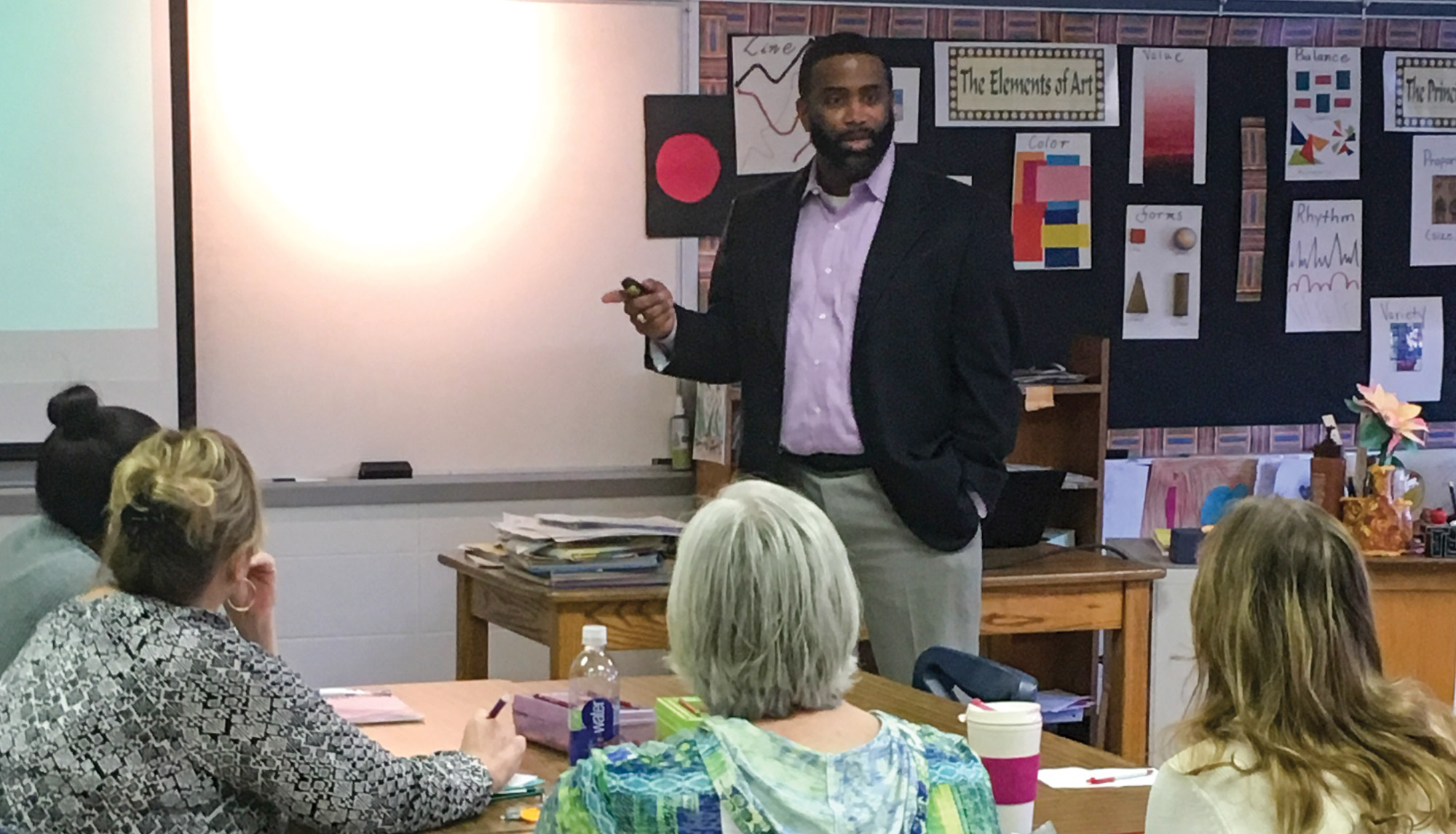 Levon Esters leads a professional development session for educators in the classroom