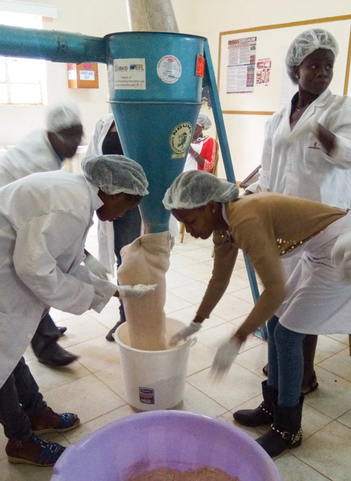 Students at the University of Eldoret, Kenya, gain hands-on experience milling cereal grains.