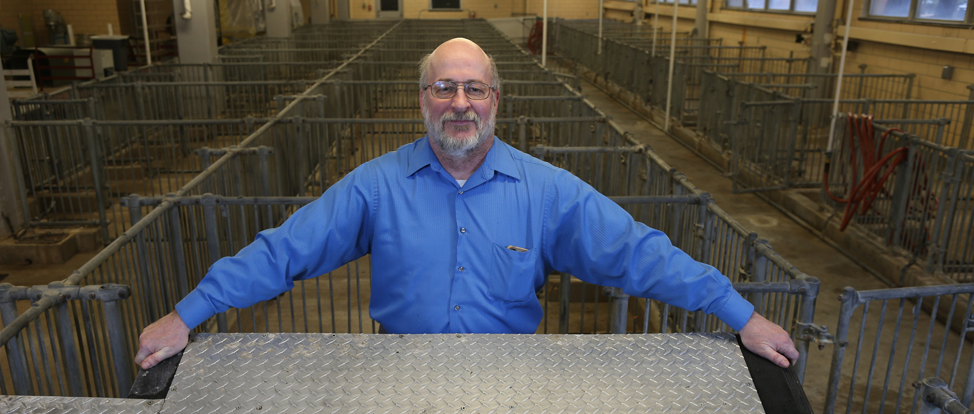 Robert Stwalley holds a 2 foot by 4 foot aluminum tread cooling pad