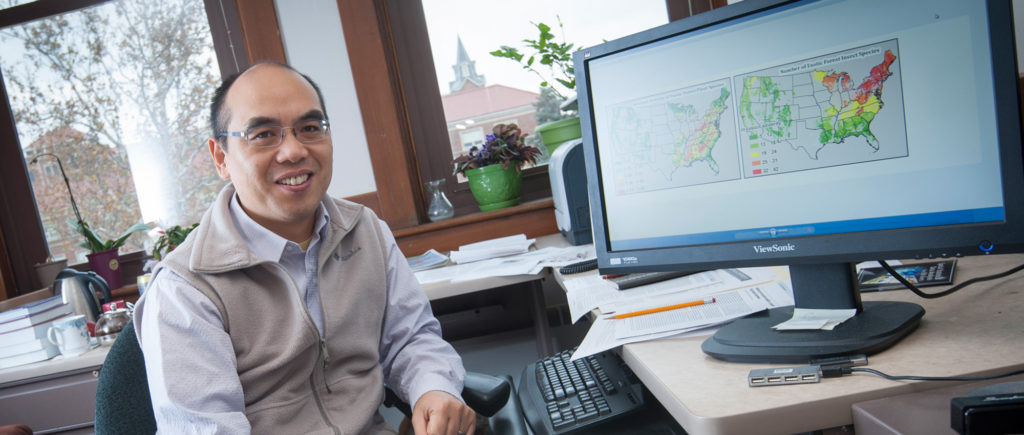 Songlin Fei, associate professor in the Department of Forestry and Natural Resources and researcher with Purdue’s Climate Change Research Center, at his computer