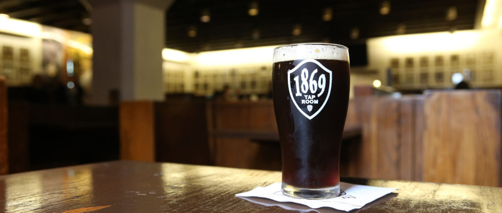 a glass of beer in the 1869 Tap Room at Purdue