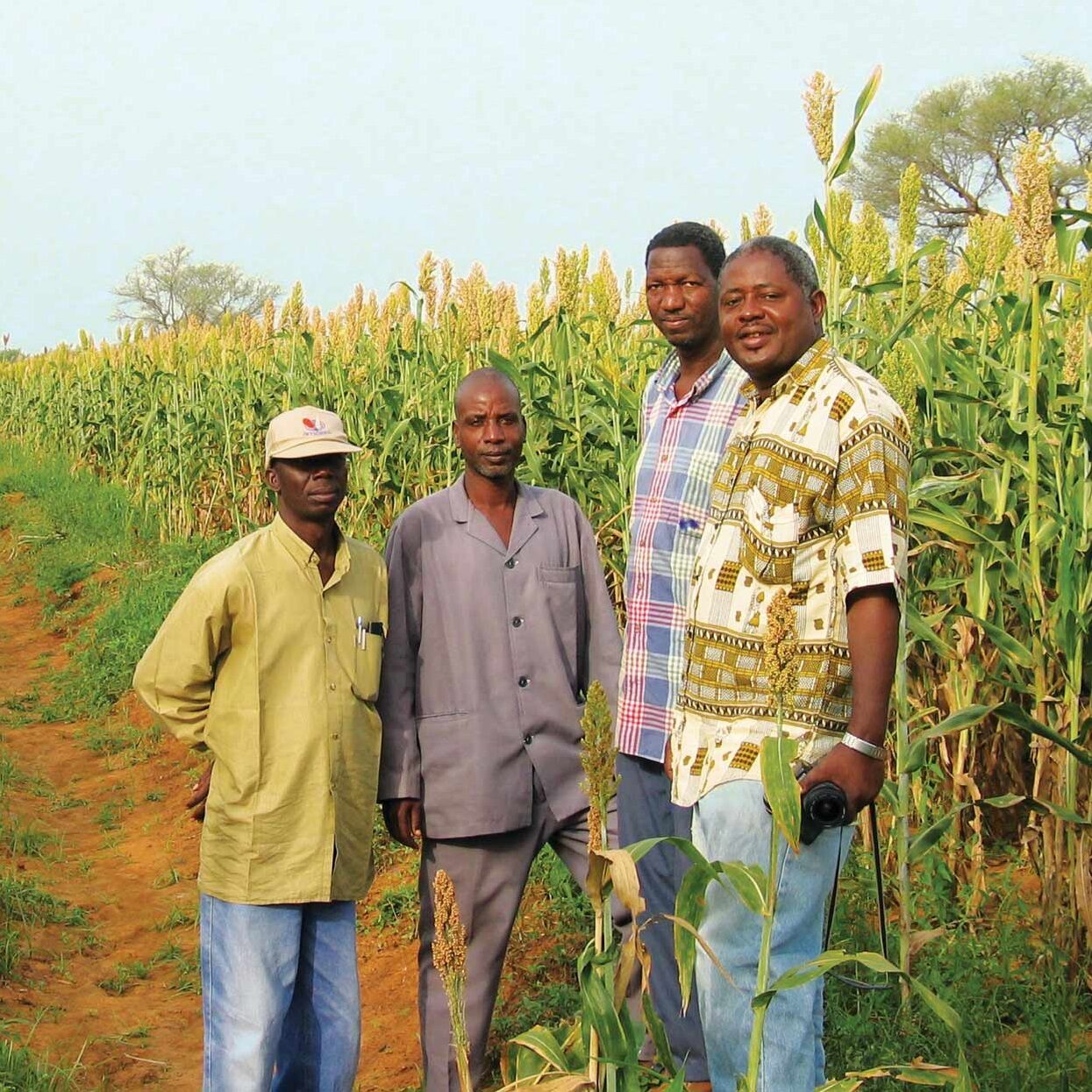 men standing together in a field