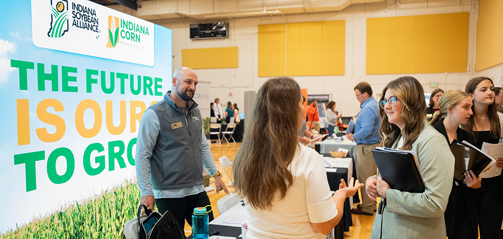 student speaks to employers during the career fair