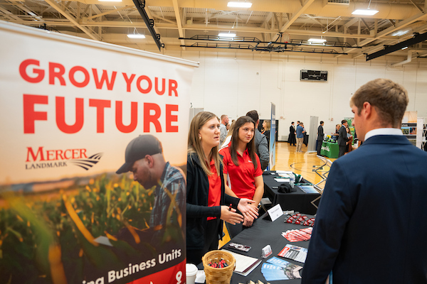 student speaks to employers during the career fair
