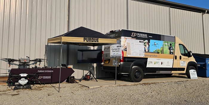Van with Purdue logo and farm images 
