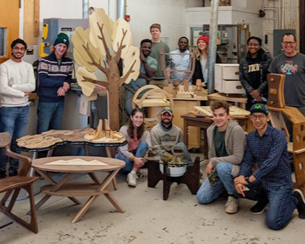 Furniture class group with their finished projects, Wood Research Lab