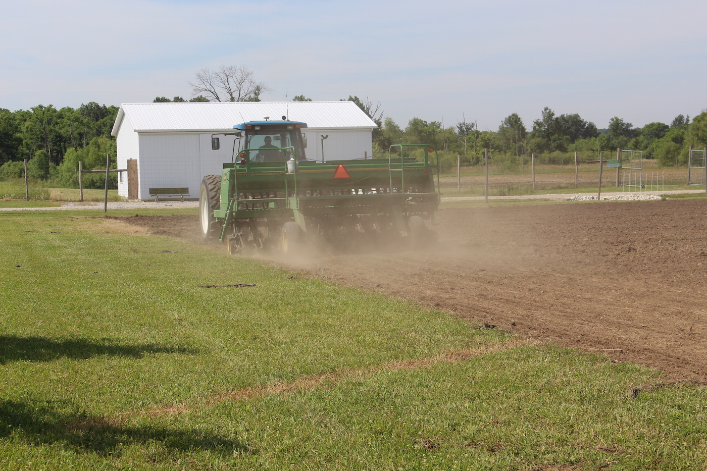 farm tractor in field planting