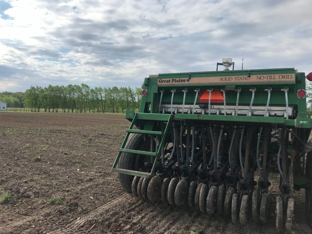Image of a farm tractor in field planting
