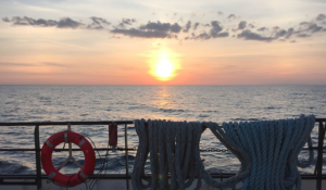 view from a boat on lake michigan of a sunset