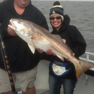 Courtney Mycroft holding a redfish