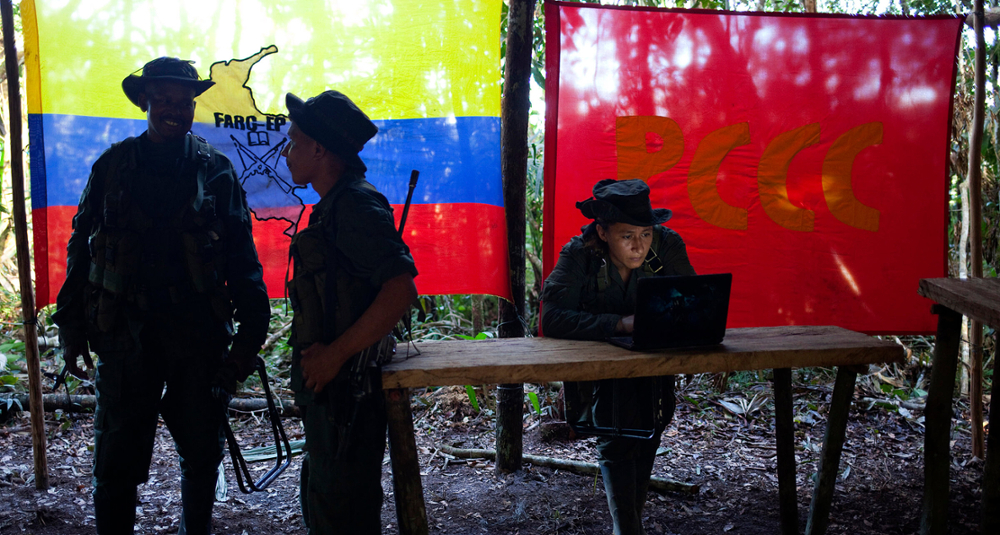 FARC rebels meet in a rebel camp in in Colombia in May 2016. Climate and environmental scientists are raising questions about how the peace process may impact forests that were previously undevelopable because of the rebel presence. (Reuters/Eliana Aponte) 
